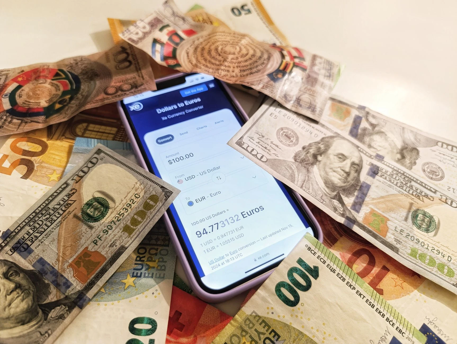 Exchange notebook and generic banknotes for travel planning, without identifying a specific currency.