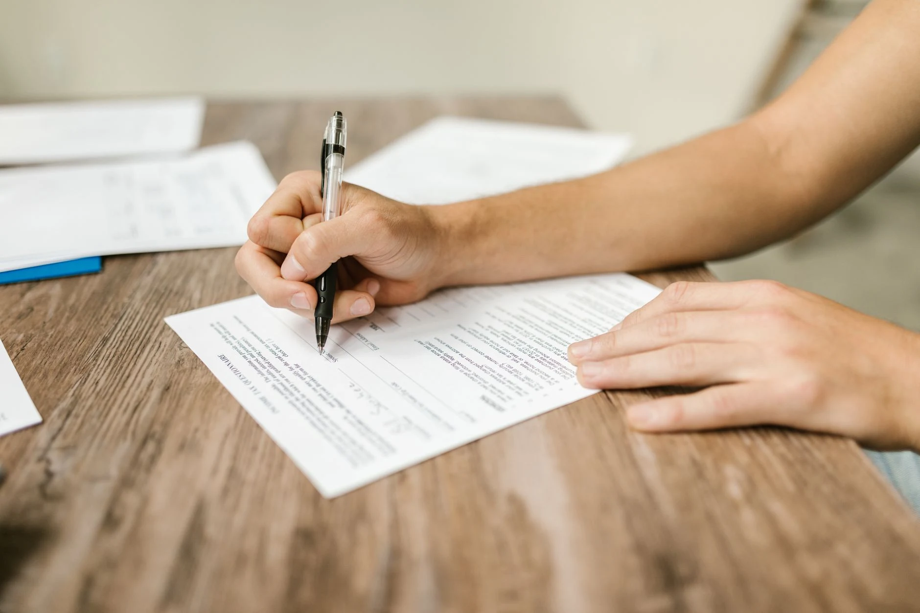 Unreadable papers and a pen in a generic preparation image.